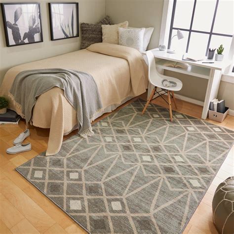Indoor rugs help to ground a space, serving as the full stage or a focal point. Exploring the studio apartment example, using separate rugs in the living and sleeping area help to make a visual separation, no walls required. And for the open floor plan example, a large area rug can serve as the centerpiece of a furniture grouping.